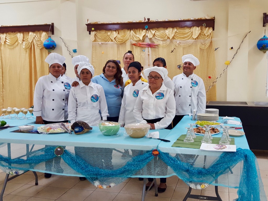 Food preparation trainees presenting their buffet style full meal course to MCCAP. Photo: Corozal ITVET