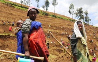 Rural farmers employ bench terracing to adapt to climate-driven erosion in Nyabihu District, Rwanda. The Direct Access project funded by the Adaptation Fund project aims to reduce flooding through integrated, sustainable land and water management and support climate-resilient agriculture and diversified, higher yields that enhance food security. It is being implemented by the Ministry of Natural Resources. Photo: Mark Sugg